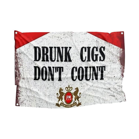 Red and white novelty flag with humorous text about smoking only when drinking, displayed on a wall.
