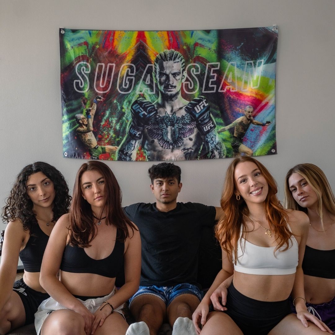Dynamic sports flag displayed behind a group of friends, featuring 'Sugar Sean' in action.