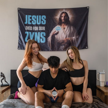 Three young adults posing with a wall flag depicting Jesus and a tobacco-free nicotine pouch, slogan overhead
