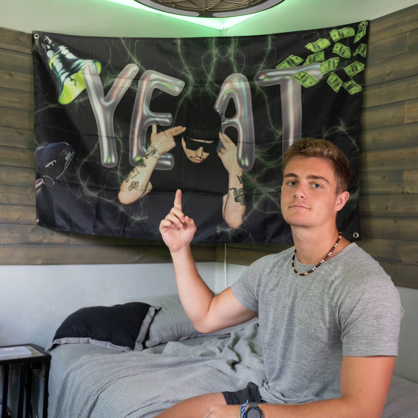 college guy in front of yeat flag