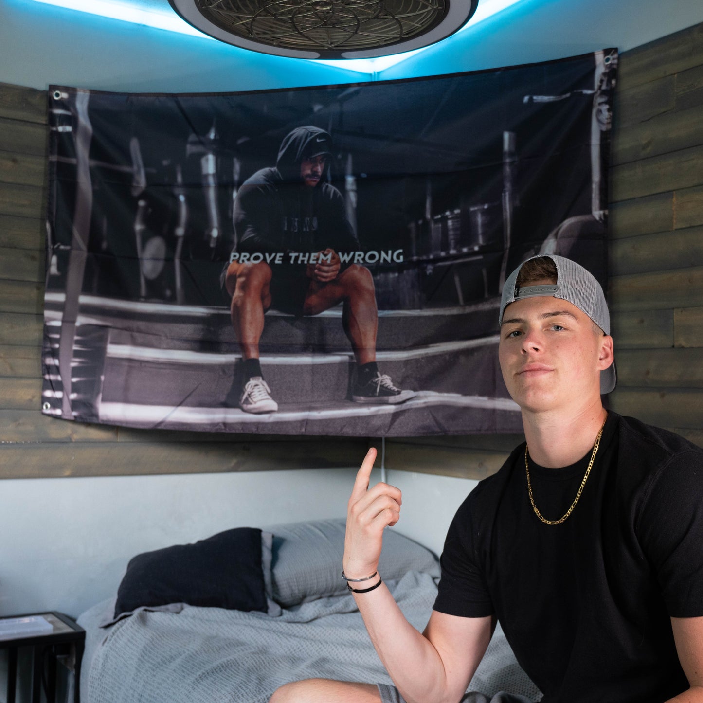 College guy pointing at motivational Chris Bumstead Flag