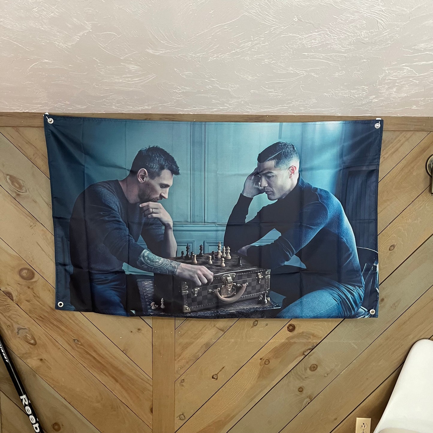 Messi and Ronaldo flag displayed in a modern room, highlighting its appeal to soccer fans, perfect for adding a touch of sports rivalry and inspiration to any space.