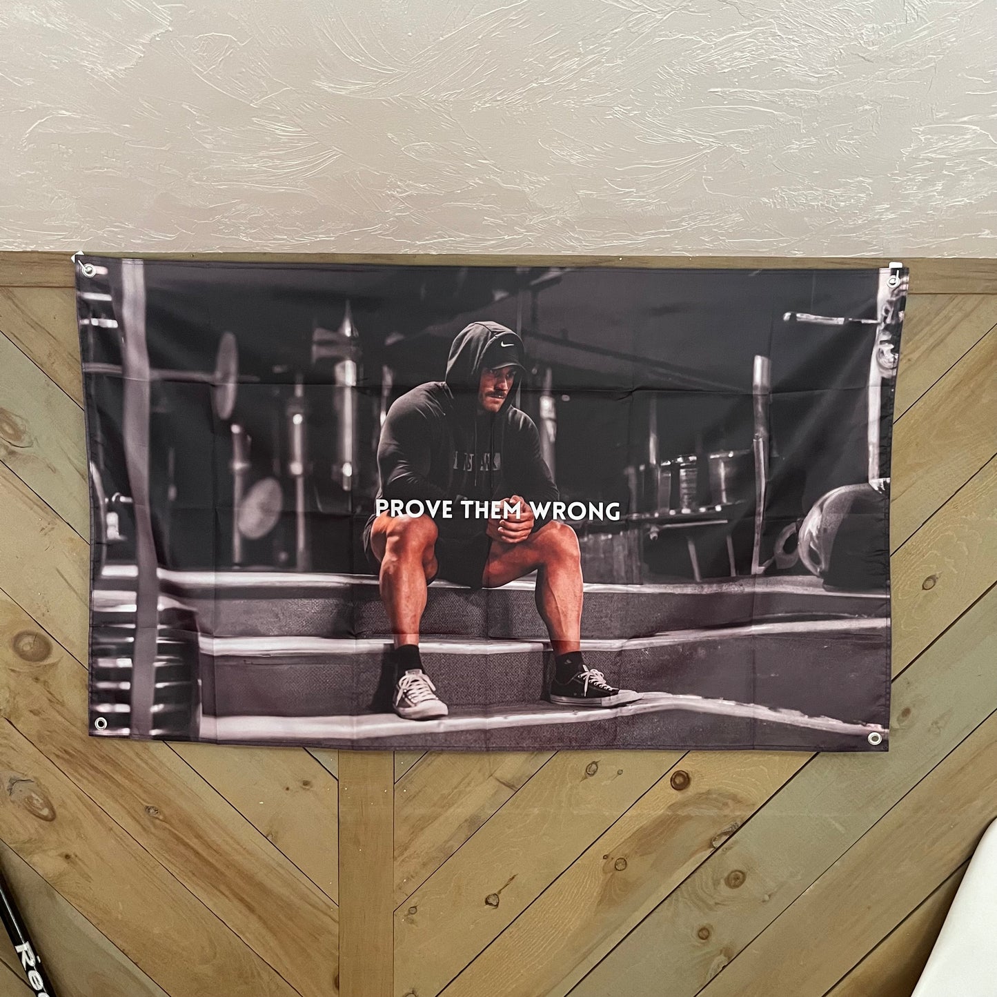 CBUM motivational flag displayed in a stylish room, emphasizing the powerful imagery of Chris Bumstead in a gym, perfect for fitness fans and home gym decor.