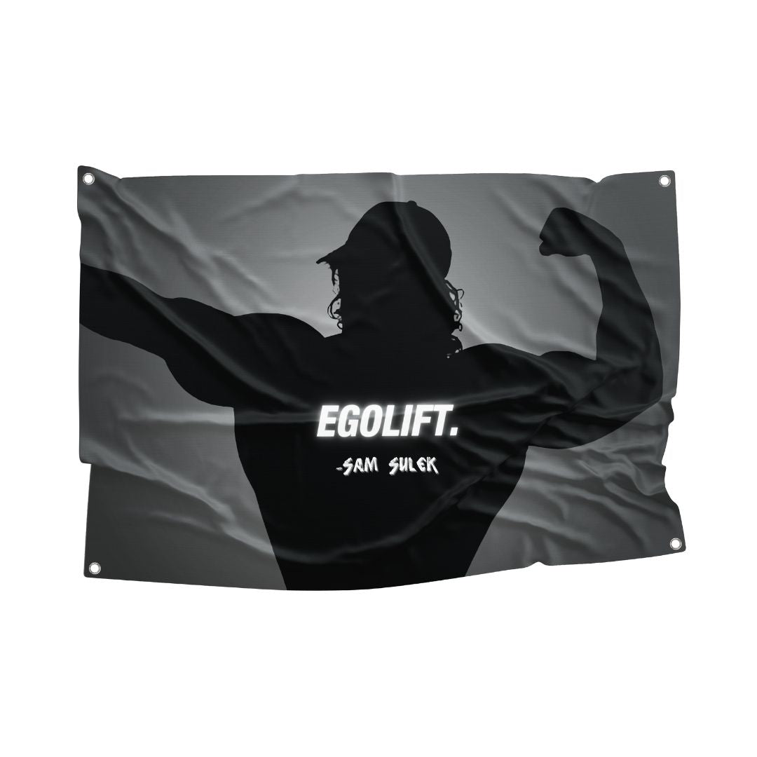 Black flag featuring a silhouette of a bodybuilder flexing, with the bold text "EGOLIFT." and the signature "- Sam Sulek" in white, highlighting the dedication and intensity of bodybuilding culture.