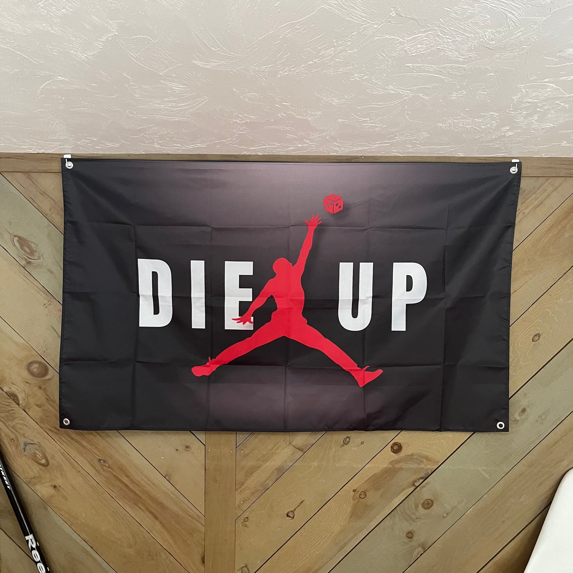 Die Up flag displayed in a modern room, adding a sporty and motivational touch to the decor, perfect for basketball fans and college dorm rooms