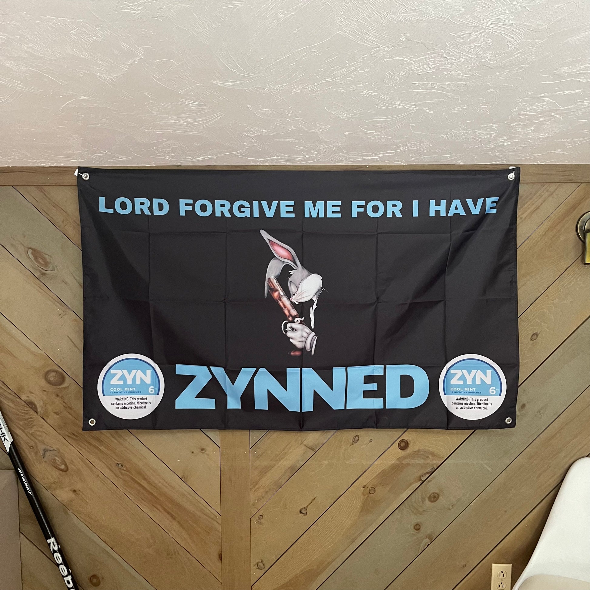 A stylish room decor setup featuring the Zyn flag on the wall, illustrating how this humorous and vibrant flag adds a unique and playful touch to any space, perfect for Zyn enthusiasts and those who enjoy quirky decor.